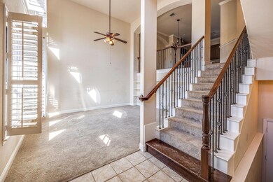 Foyer entrance with carpet, a high ceiling, ceilin
