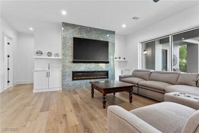 Living room with a premium fireplace and light har