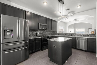 Kitchen featuring appliances with stainless steel