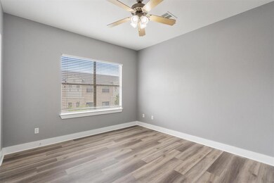 Empty room with wood finished floors and a ceilin