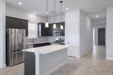 Kitchen featuring appliances with stainless steel
