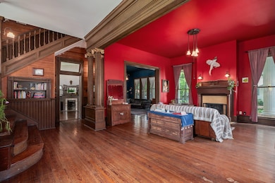 Living area featuring a fireplace, healthy amount