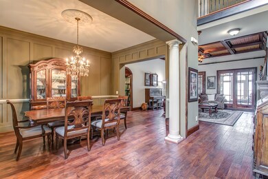 Warm accent wood, coffered ceilings, plantation shutters, and stately columns add both a uniqueness and continuity to the home's layout.