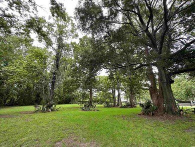 Cute picnic area by pond in common greenspace