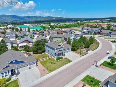 Aerial view of residential area featuring a mountainous background