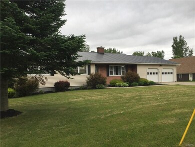 Left side of house.