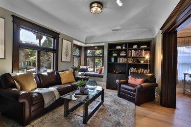 4. Charming Craftsman dark wood, door and window casings; custom Room & Board bookcases