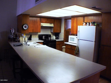 Kitchen w oversized breakfast bar.