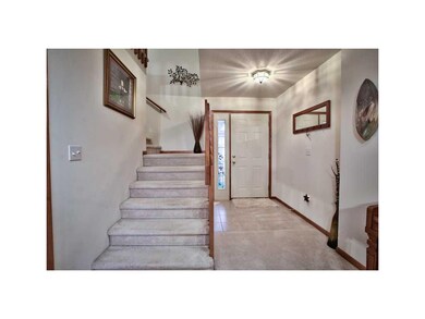 Entryway. CERAMIC TILE FOYER, OPEN RAIL TO SECOND 