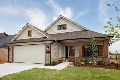 View of front of house featuring concrete driveway
