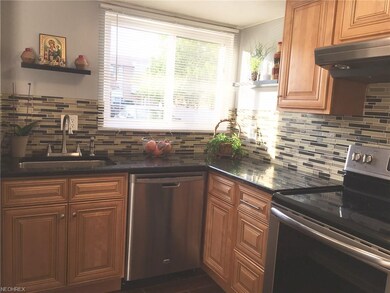Kitchen contains ceramic flooring and includes dis