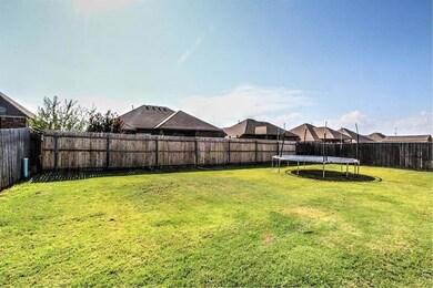 View of yard with a trampoline