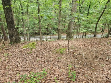 View of yard featuring a forest view