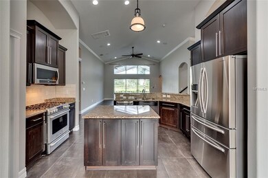 Kitchen w/ new fridge and microwave. Granite count