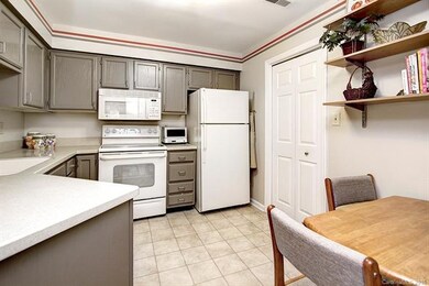 Kitchen opens to living and dining areas and offer