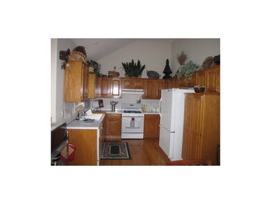 Hardwood floors in kitchen, gas stove, many cabine
