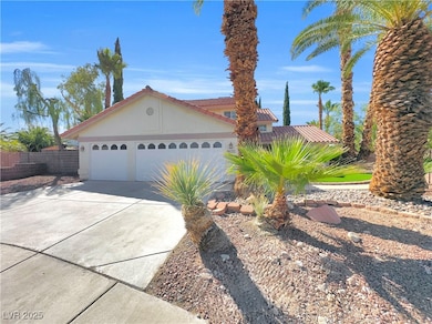 View of front facade featuring driveway, a garage,