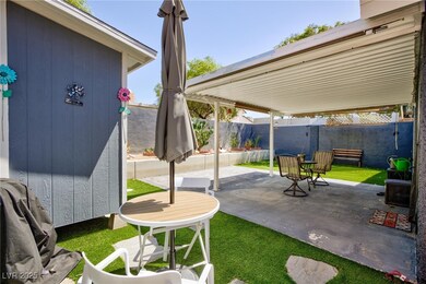 Fenced backyard with a patio area