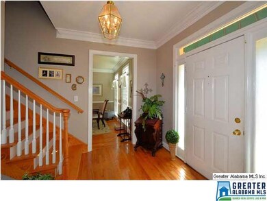 FOYER HAS HARDWOOD FLOOR, WOOD STAIRWAY, HALLWAY T