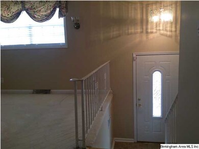 Entrance to split foyer and living area.