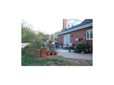 View of brick patio on back of home.