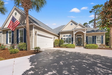 View of front of house featuring concrete driveway
