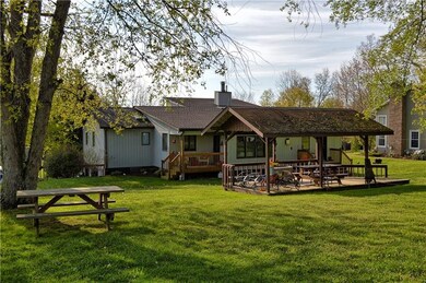 Rear of home with covered deck off of family room.