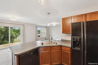 Open Kitchen with Black Appliances