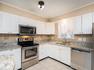 Kitchen carries on the updated granite countertops and stainless steel appliances!