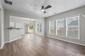 Unfurnished living room with wood finished floors,