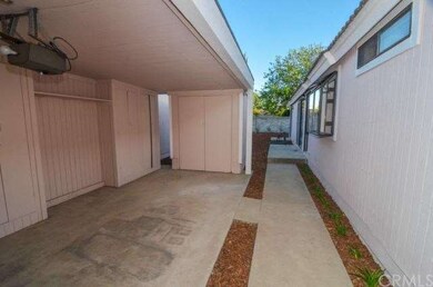 Opened covered parking with storage. Newly landsca