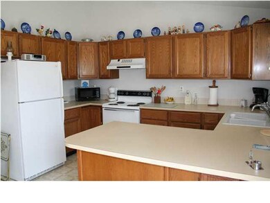 Kitchen features an eating bar, window overlooking