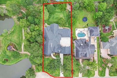 Oversized lot accommodates 5,000+ sq foot 1-story home (with only a gameroom upstairs) and still offers generous front and backyard spaces. Note the gated motor court between the two 2-car garages.
