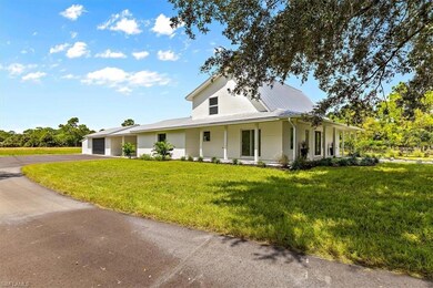 Farmhouse-style home featuring covered porch, a fr