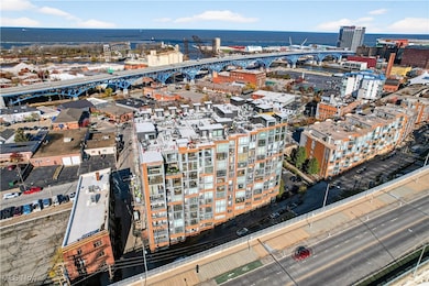 View of urban area featuring a notable bridge and a nearby body of water