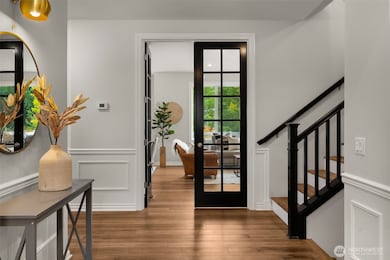 Coordinated trim. The french doors match the entry trim in a dramatic black tone and from inside the family room they are white to match the trim in that room. You will notice these thoughtful touches throughout the home.