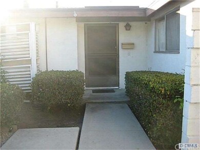 Front entry with kitchen window on the right. Also