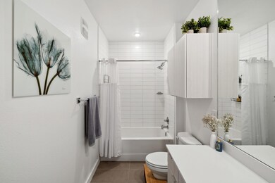 Bathroom featuring vanity, tile patterned floors,