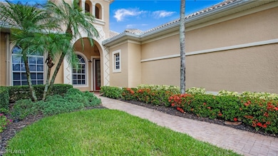 Property entrance with stucco siding and a tile ro