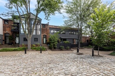 Private cobblestone parking lot with assigned spac