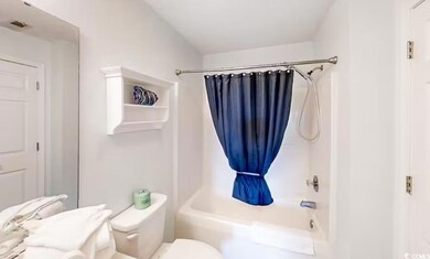 Full bath with shower / tub combo and toilet