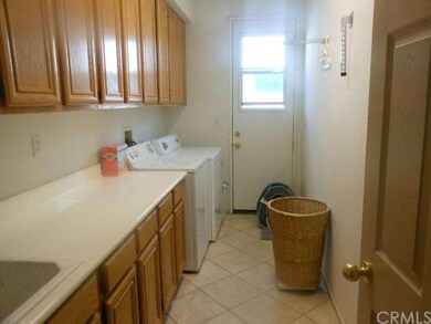 Huge laundry with tons of storage cabinets, sink a