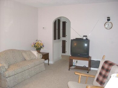 Different view of living room toward hallway.
