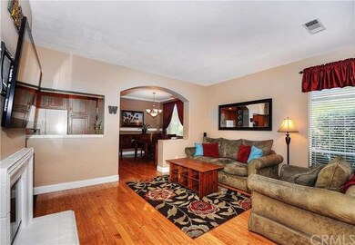 Living room with cozy fireplace, high ceilings and