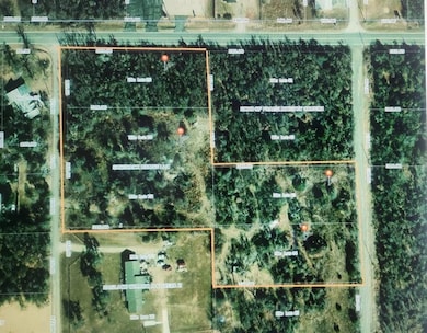 Aerial view of property's location with property boundaries highlighted of all 4 lots