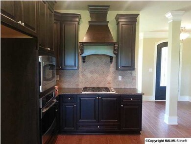 Full overlay soft close cabinets and drawers, Decorative direct veng range hood over GE Profile GAS cooktop, built in oven/microwave, Granite, tumbled stone backsplash