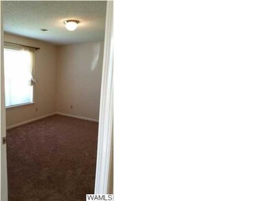 The guest bedroom is large with a walk-in closet,