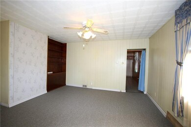 Large Living Room with Ceiling Fan gives access to
