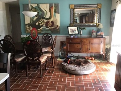 Dining room opens to the kitchen and backyard.