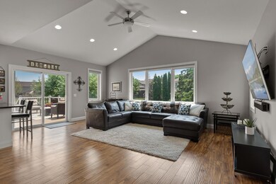 Large vaulted main-floor family room w/loads of recessed lighting and walk-out to maintenance free deck.